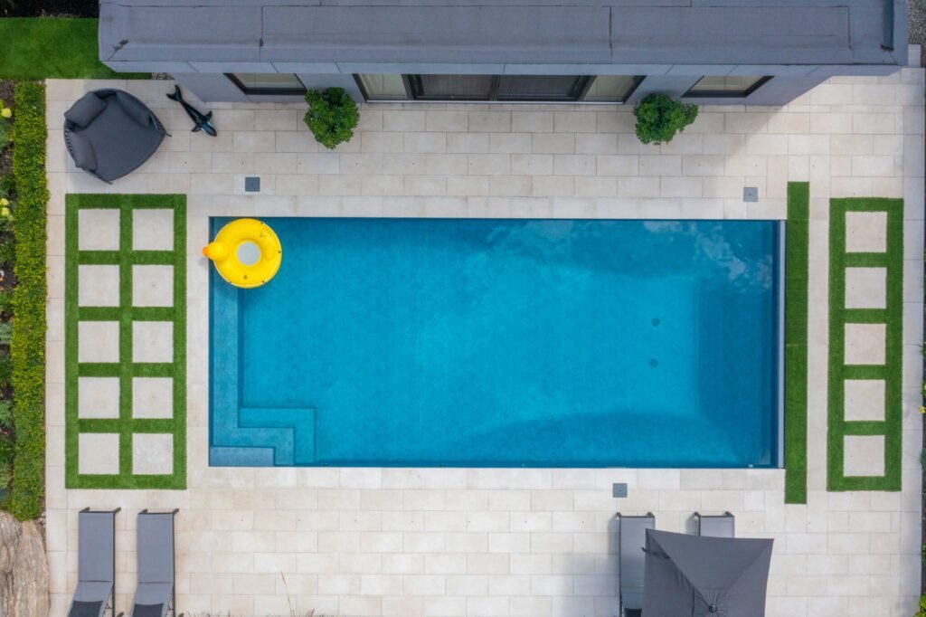 blue rectangle pool white stone